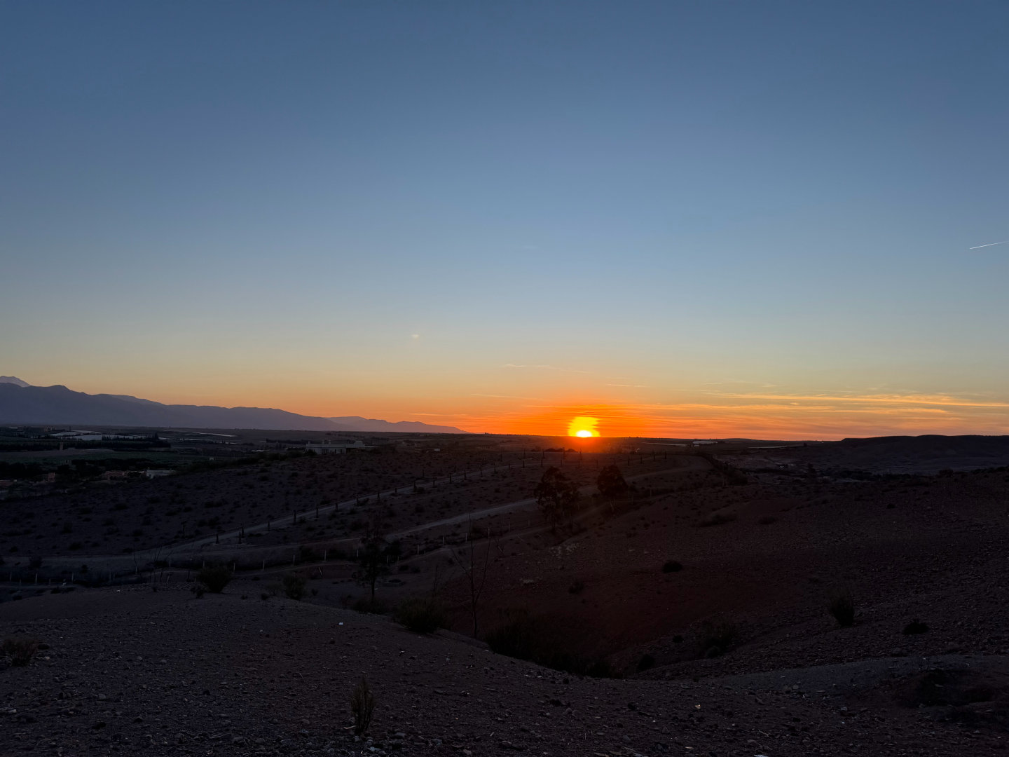 The Agafay Desert is a breathtaking rocky desert located just 30 kilometers south of Marrakech, Morocco, offering a striking contrast to the Sahara’s golden dunes. Known for its lunar-like terrain of rugged plateaus, dry riverbeds, and undulating hills, the Agafay Desert provides a unique escape for adventure seekers and luxury travelers alike. Visitors can enjoy thrilling activities like camel rides, quad biking, and stargazing under pristine night skies, as well as unwind in upscale desert camps with pools and gourmet dining. Easily accessible from Marrakech, this "stone desert" is perfect for day trips or overnight stays, blending adventure with cultural immersion—experience Berber hospitality, scenic hikes, and unforgettable sunsets in one of Morocco’s most captivating landscapes. Whether you seek adrenaline-fueled excursions or serene desert luxury, the Agafay Desert delivers an unforgettable Moroccan escape.